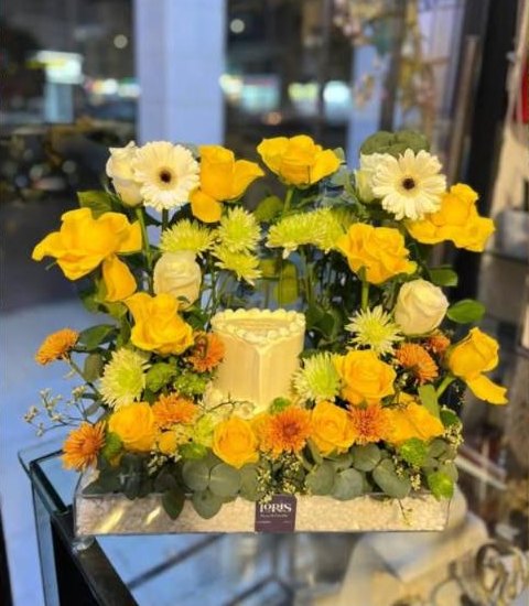 Yellow cake and flower box